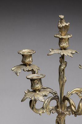 Pair of candelabras in chased and gilded...