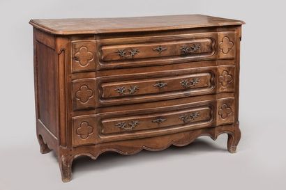 Walnut chest of drawers, the front curved...