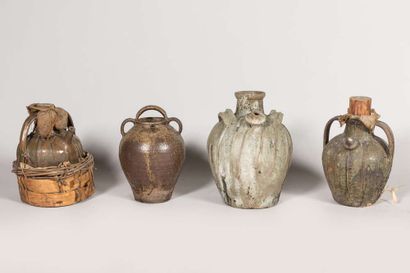 Three glazed earthenware oil jugs, two-handled...