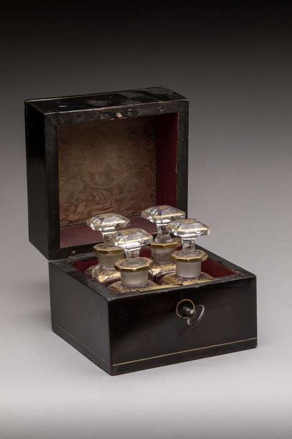 Small square-shaped ebony or blackened wood...