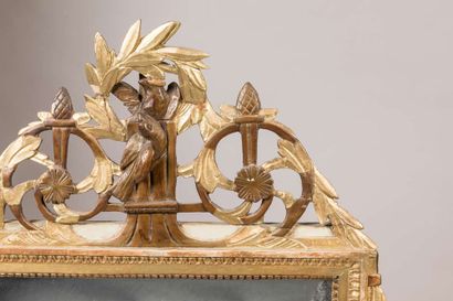 Mirror in a carved and gilded wood frame....