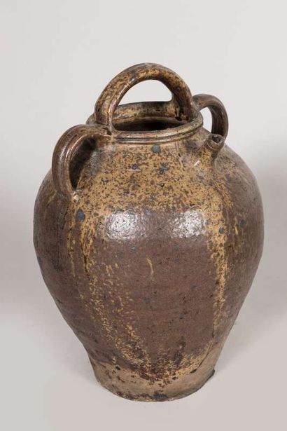 Three glazed earthenware oil jugs, two-handled...