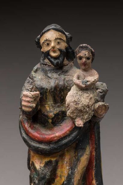 Three religious statuettes in polychrome...