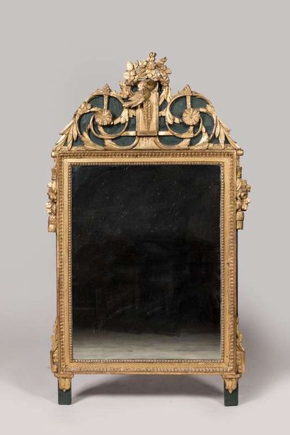 Mirror in a carved and gilded wood frame...