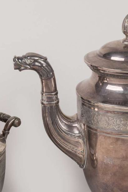 Three pieces of coffee service on pedestal...