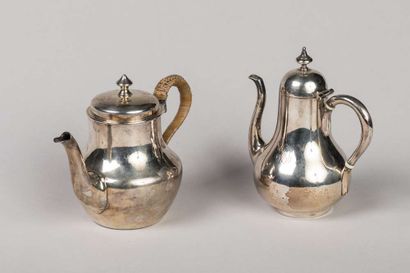 2 small self-serving pourers in plain silver,...