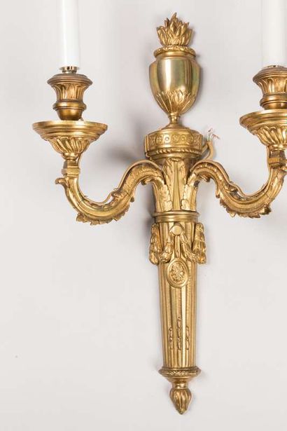 Pair of sconces in chased and gilded bronze...