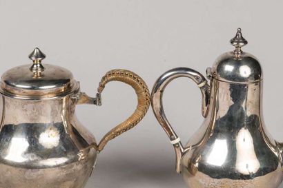 2 small self-serving pourers in plain silver,...
