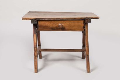 Walnut table opening to a drawer in the belt...