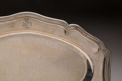 Oval silver platter with scalloped edges...
