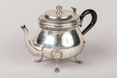 Round baluster coffee pot in silver resting...