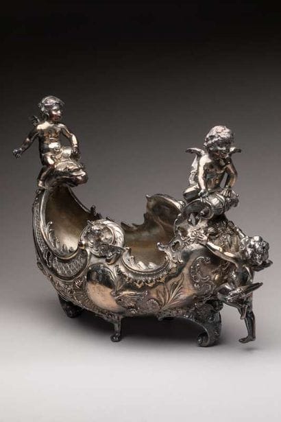 Planter in the shape of silver plated metal...