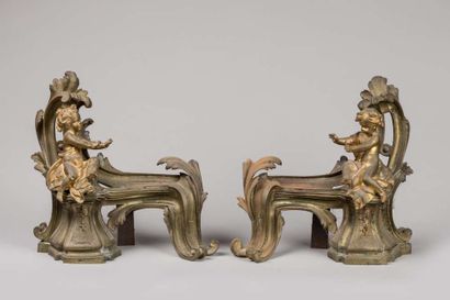 Pair of mantelpieces decorated with cherubs...