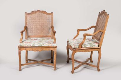 Pair of armchairs with a cane base, molded...