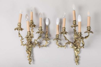 Pair of sconces in chased and gilded bronze...