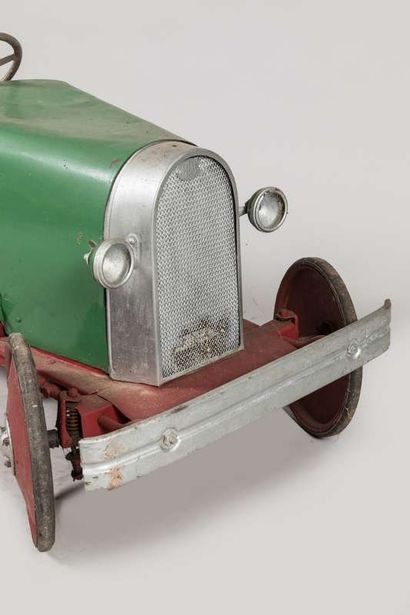 A pedal car in painted metal and repainted...