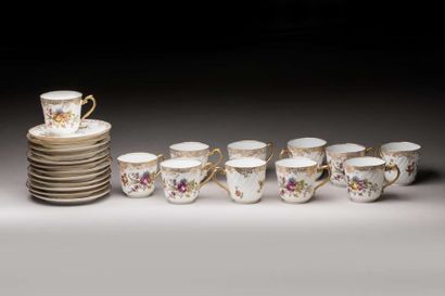 Eleven porcelain cups and saucers with floral...