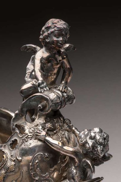 Planter in the shape of silver plated metal...