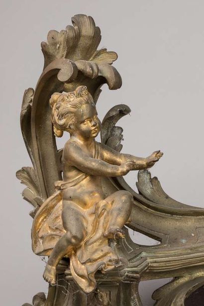 Pair of mantelpieces decorated with cherubs...