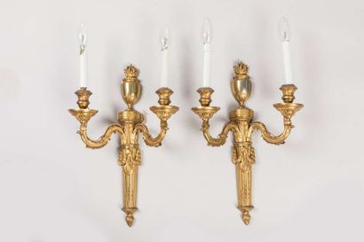 Pair of sconces in chased and gilded bronze...