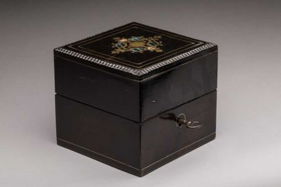 Small square-shaped ebony or blackened wood...