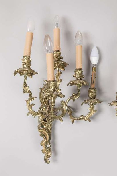 Pair of sconces in chased and gilded bronze...