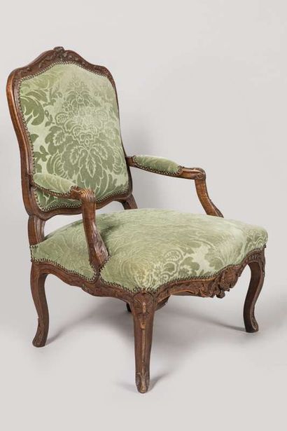 Pair of armchairs in carved wood decorated...
