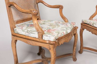 Pair of armchairs with a cane base, molded...