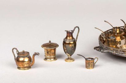 On a small silver and vermeil tray, miniature...