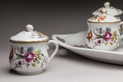 Eleven creamers and their tray in porcelain...