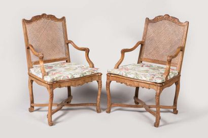 Pair of armchairs with a cane base, molded...