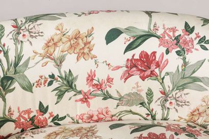 Sofa of corbeille form, front legs on casters,...