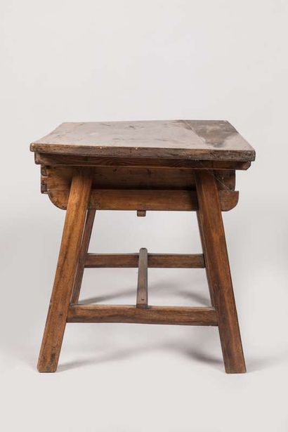 Walnut table opening to a drawer in the belt...