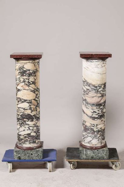 Pair of cylindrical columns in veined white...
