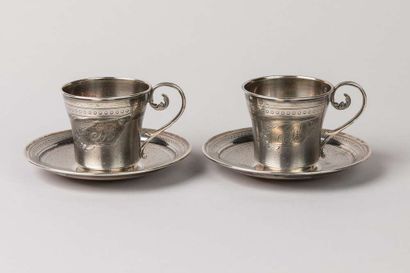 Two silver cups with saucers (one dented),...
