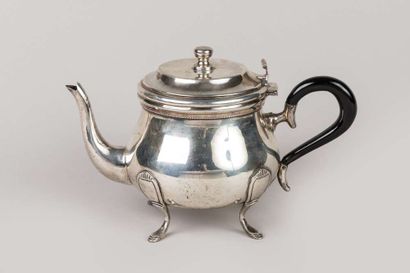 Round baluster coffee pot in silver resting...