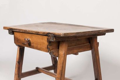 Walnut table opening to a drawer in the belt...
