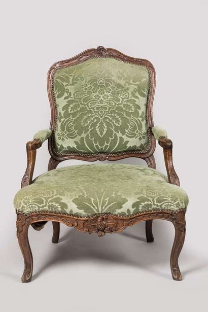 Pair of armchairs in carved wood decorated...