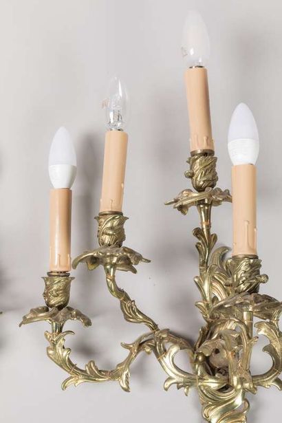 Pair of sconces in chased and gilded bronze...