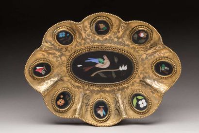 Gilded metal bowl of oval shape, with wavy...