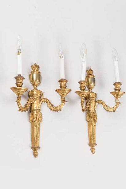 Pair of sconces in chased and gilded bronze...