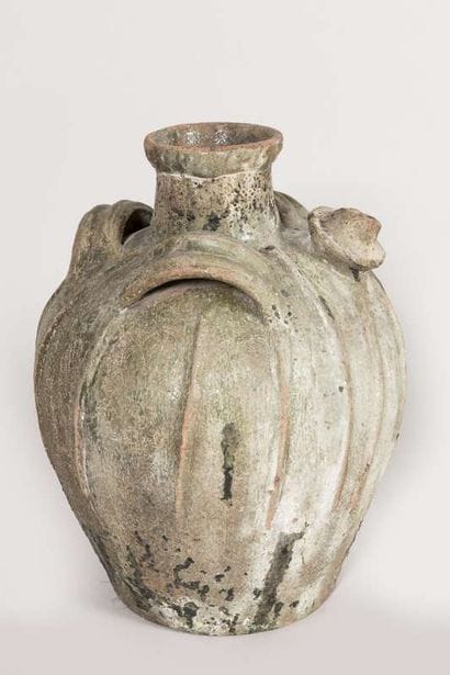 Three glazed earthenware oil jugs, two-handled...