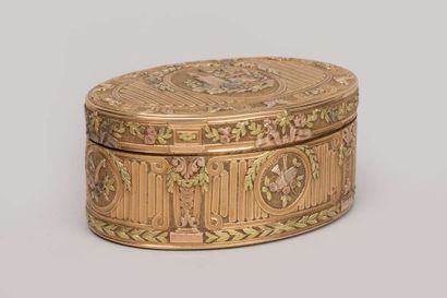 Three-tone gold box of oval shape decorated...