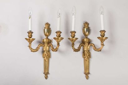 Pair of sconces in chased and gilded bronze...