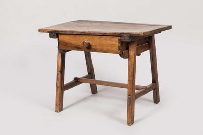 Walnut table opening to a drawer in the belt...