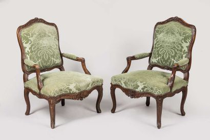 Pair of armchairs in carved wood decorated...