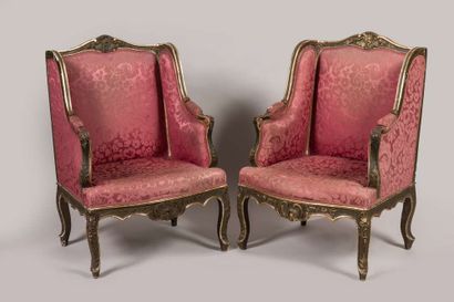 Suite of four carved, stuccoed, gilded and...