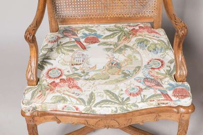 Pair of armchairs with a cane base, molded...