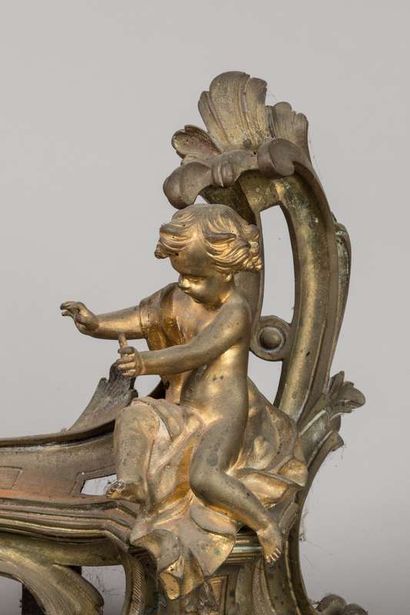 Pair of mantelpieces decorated with cherubs...