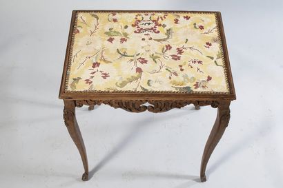 Molded and carved walnut table with openwork...